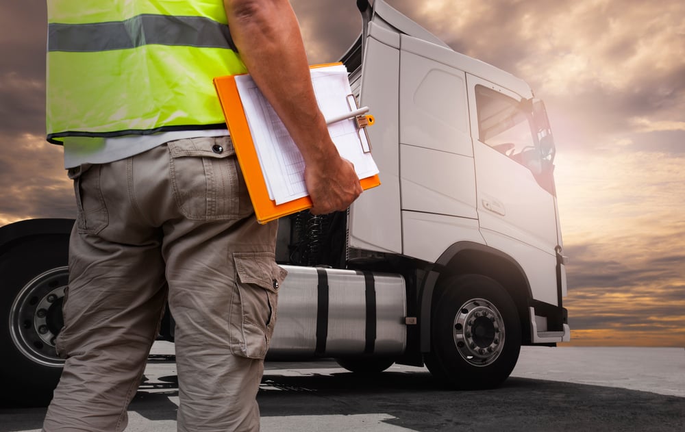 Truck Driver is Checking the Truck's Safety Maintenance Checklist